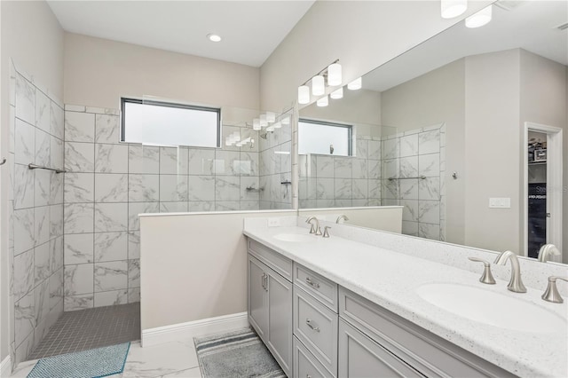 13708 Old Creek Ct, Parrish, FL 34219 - bathroom featuring marble finish floors, walk in shower, double vanity, and baseboards