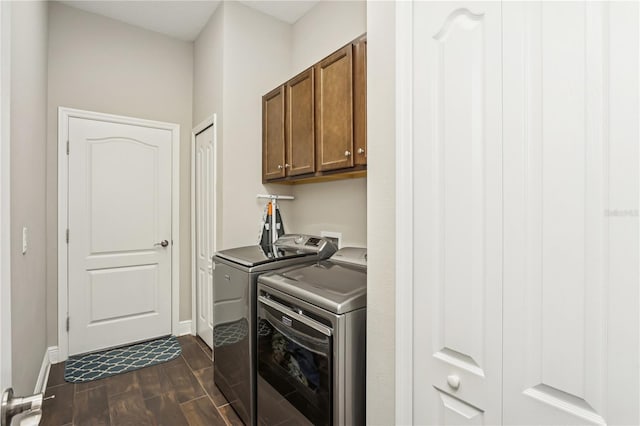 13708 Old Creek Ct, Parrish, FL 34219 - laundry area featuring cabinet space, independent washer and dryer, dark wood finished floors, and baseboards