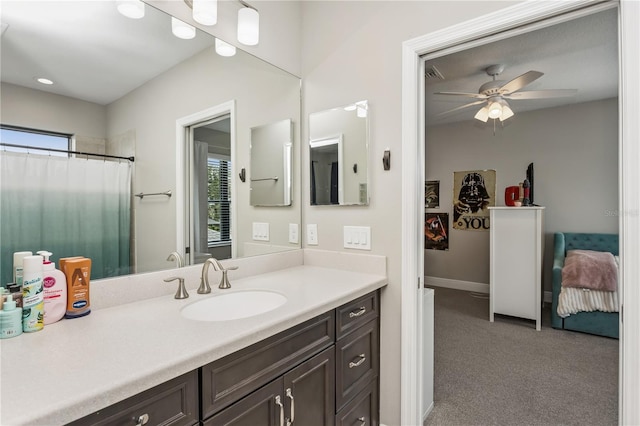 13708 Old Creek Ct, Parrish, FL 34219 - bathroom with plenty of natural light, vanity, ceiling fan, and baseboards