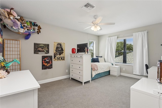 13708 Old Creek Ct, Parrish, FL 34219 - bedroom with light carpet, baseboards, and ceiling fan