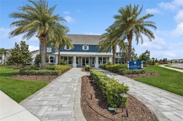 13708 Old Creek Ct, Parrish, FL 34219 - view of front facade with a front yard and french doors