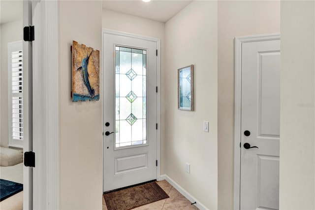 17725 Northwood Pl, Bradenton, FL 34202 - foyer with healthy amount of natural light, baseboards, and light tile patterned floors