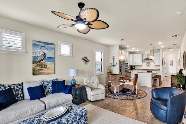 17725 Northwood Pl, Bradenton, FL 34202 - living area featuring light tile patterned flooring, a ceiling fan, recessed lighting, and baseboards