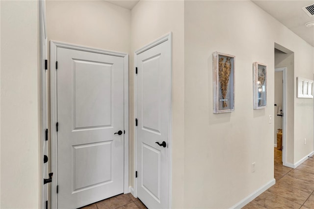 17725 Northwood Pl, Bradenton, FL 34202 - hall featuring light tile patterned flooring and baseboards