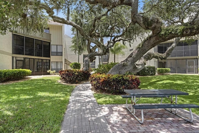 6157 Midnight Pass Rd Unit E73, Sarasota, FL 34242 - view of community with a lawn