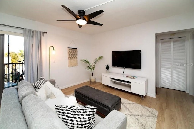 6157 Midnight Pass Rd Unit E73, Sarasota, FL 34242 - living area with ceiling fan, light wood-type flooring, and baseboards