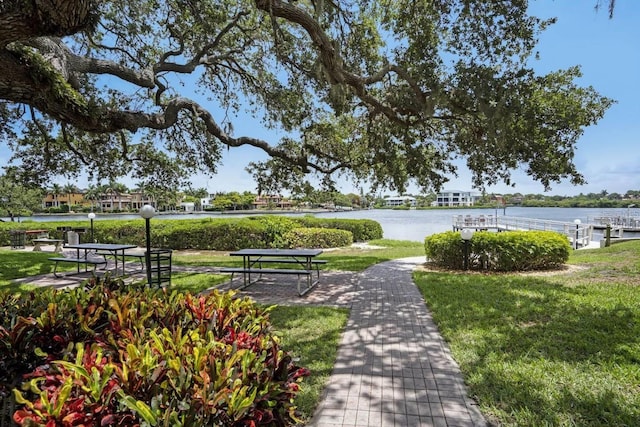 6157 Midnight Pass Rd Unit E73, Sarasota, FL 34242 - view of community with a water view and a lawn