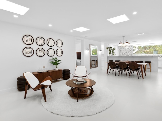 7647 Sanderling Rd, Sarasota, FL 34242 - living area with a skylight, a chandelier, and recessed lighting