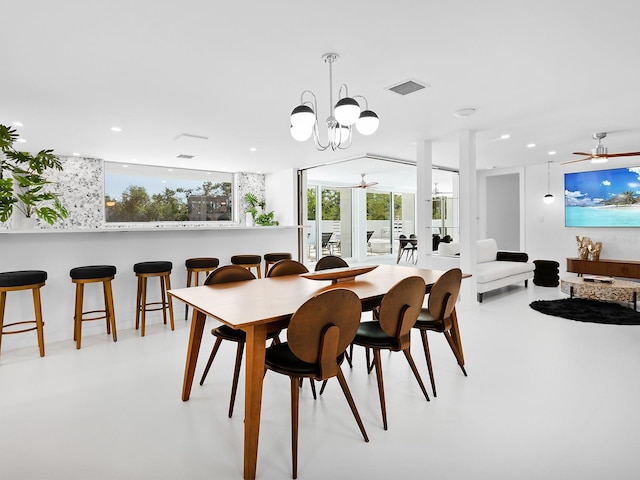 7647 Sanderling Rd, Sarasota, FL 34242 - dining room with a ceiling fan, recessed lighting, and concrete floors
