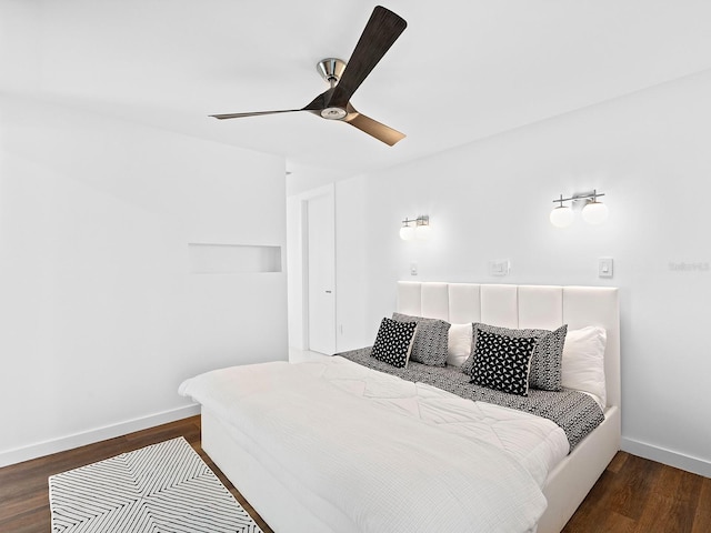 7647 Sanderling Rd, Sarasota, FL 34242 - bedroom featuring dark wood-style flooring, baseboards, and ceiling fan