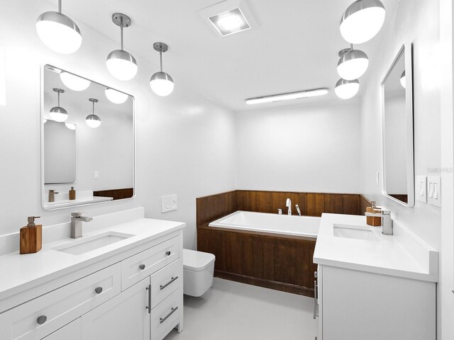 7647 Sanderling Rd, Sarasota, FL 34242 - full bath with vanity, a garden tub, and toilet