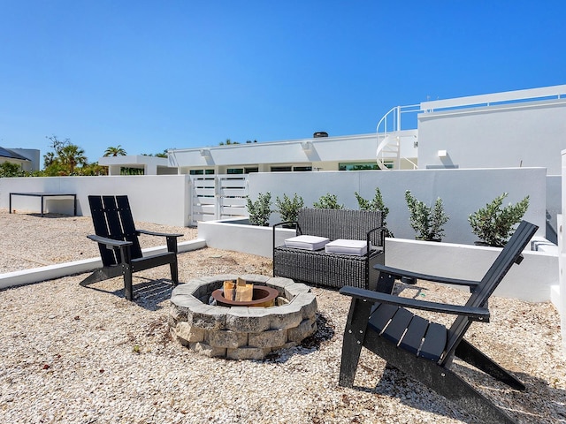 7647 Sanderling Rd, Sarasota, FL 34242 - view of patio / terrace with a fire pit