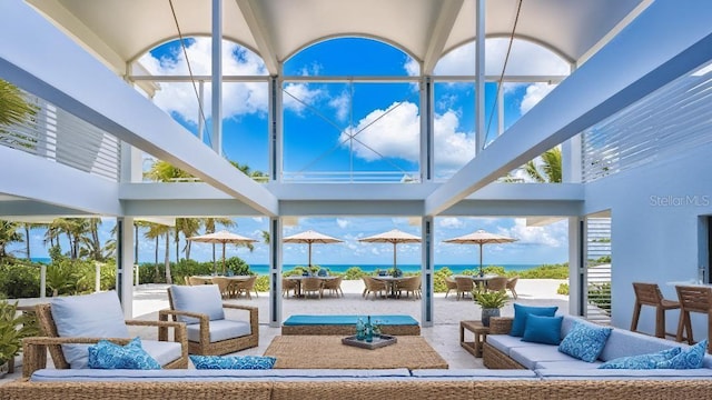 7647 Sanderling Rd, Sarasota, FL 34242 - view of patio featuring outdoor lounge area, outdoor dining area, and a water view