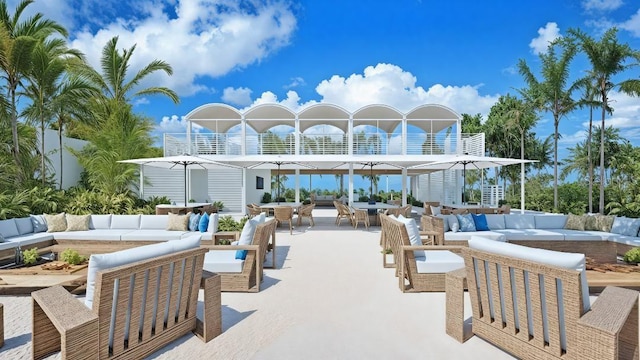 7647 Sanderling Rd, Sarasota, FL 34242 - view of patio / terrace featuring an outdoor living space, outdoor dining area, and a balcony