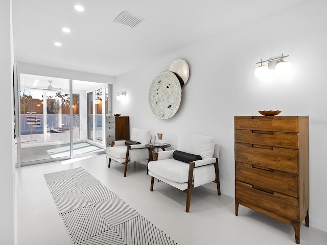 7647 Sanderling Rd, Sarasota, FL 34242 - living area with recessed lighting, concrete floors, ceiling fan, and french doors