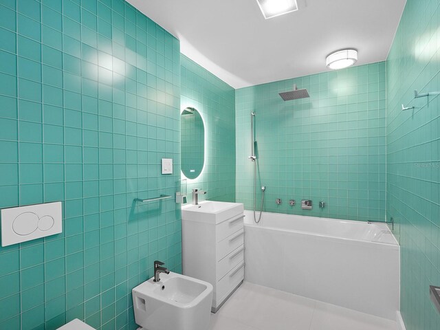 7647 Sanderling Rd, Sarasota, FL 34242 - full bath featuring vanity, tile walls, a bidet, shower / bathtub combination, and tile patterned floors