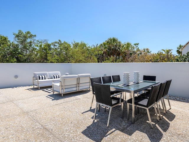 7647 Sanderling Rd, Sarasota, FL 34242 - view of patio / terrace with an outdoor living space and outdoor dining area
