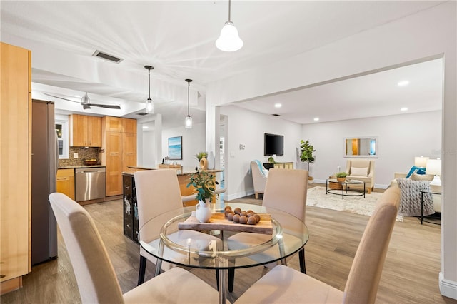 2419 Riverbluff Pkwy Unit V233, Sarasota, FL 34231 - dining space featuring light wood-style floors, recessed lighting, and baseboards