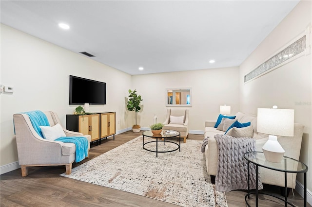 2419 Riverbluff Pkwy Unit V233, Sarasota, FL 34231 - living area featuring baseboards, wood finished floors, and recessed lighting
