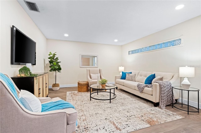 2419 Riverbluff Pkwy Unit V233, Sarasota, FL 34231 - living area with light wood-type flooring, baseboards, and recessed lighting