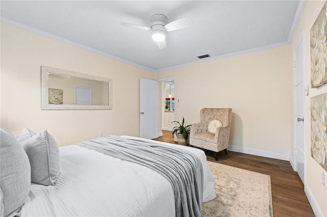 2419 Riverbluff Pkwy Unit V233, Sarasota, FL 34231 - bedroom featuring crown molding, dark wood-style flooring, baseboards, and ceiling fan