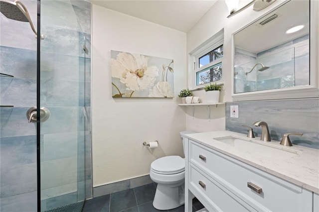 2419 Riverbluff Pkwy Unit V233, Sarasota, FL 34231 - full bathroom with tile patterned flooring, a tile shower, vanity, and toilet