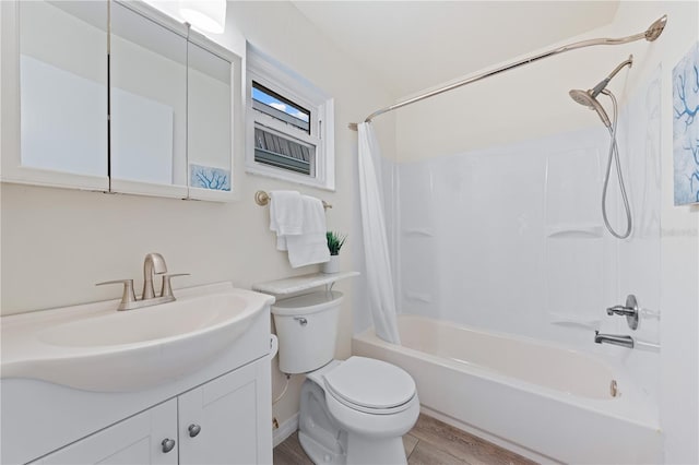 2419 Riverbluff Pkwy Unit V233, Sarasota, FL 34231 - bathroom featuring vanity, toilet, shower / bath combo, and wood finished floors