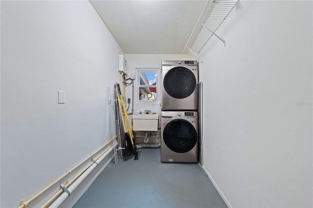 2419 Riverbluff Pkwy Unit V233, Sarasota, FL 34231 - laundry room with stacked washing machine and dryer and baseboards