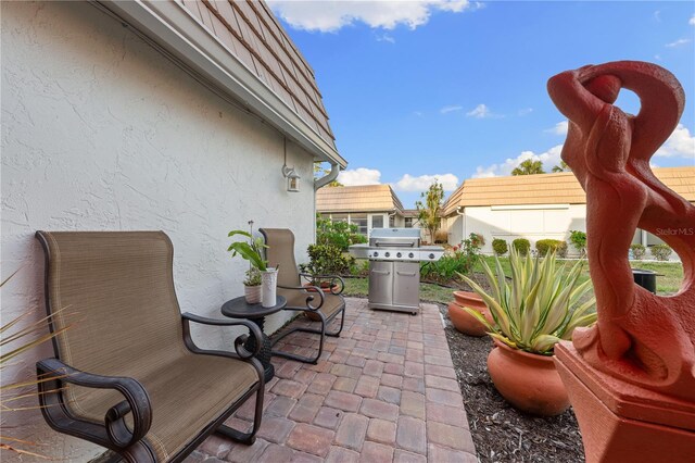 2419 Riverbluff Pkwy Unit V233, Sarasota, FL 34231 - view of patio / terrace with a grill
