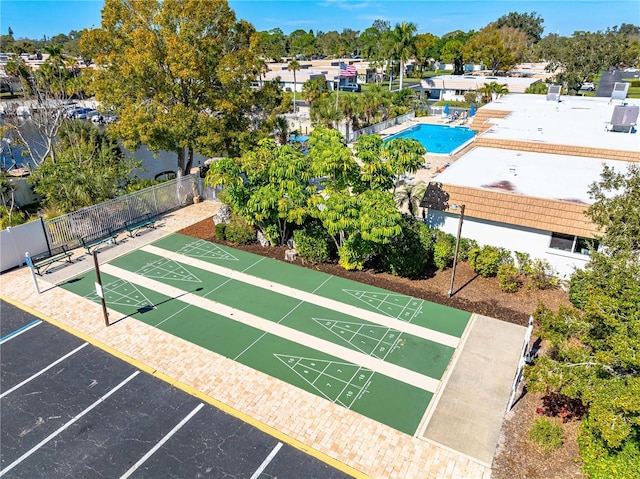 2419 Riverbluff Pkwy Unit V233, Sarasota, FL 34231 - view of community with shuffleboard, uncovered parking, and a swimming pool