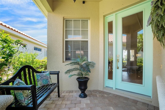 7164 Rue De Palisades Unit 5, Sarasota, FL 34238 - property entrance with stucco siding