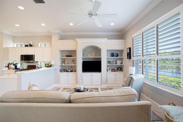 7164 Rue De Palisades Unit 5, Sarasota, FL 34238 - living area featuring recessed lighting, a ceiling fan, baseboards, and ornamental molding