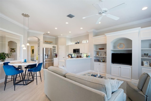 7164 Rue De Palisades Unit 5, Sarasota, FL 34238 - living room featuring arched walkways, ornamental molding, recessed lighting, ceiling fan, and light wood-style floors