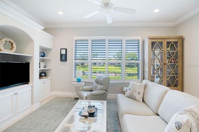 7164 Rue De Palisades Unit 5, Sarasota, FL 34238 - living area featuring built in features, ornamental molding, a ceiling fan, baseboards, and recessed lighting