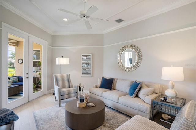 7164 Rue De Palisades Unit 5, Sarasota, FL 34238 - living area featuring wood finished floors, french doors, a ceiling fan, ornamental molding, and recessed lighting