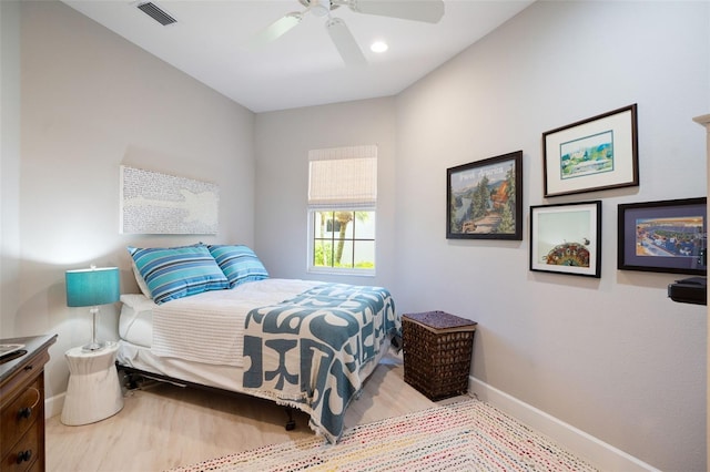 7164 Rue De Palisades Unit 5, Sarasota, FL 34238 - bedroom with baseboards, wood finished floors, and ceiling fan