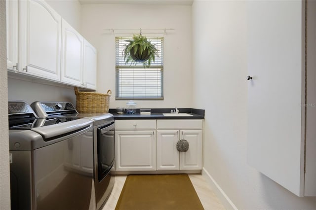 7164 Rue De Palisades Unit 5, Sarasota, FL 34238 - laundry area featuring washing machine and clothes dryer, cabinet space, baseboards, and light wood-style floors
