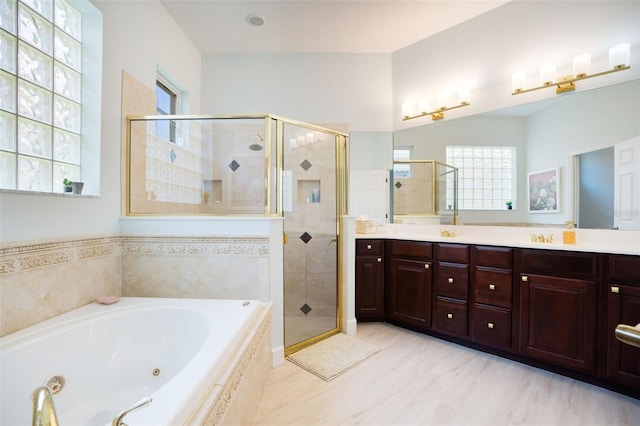 7164 Rue De Palisades Unit 5, Sarasota, FL 34238 - full bathroom with a whirlpool tub, a stall shower, and double vanity