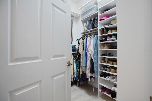 7164 Rue De Palisades Unit 5, Sarasota, FL 34238 - spacious closet featuring wood finished floors