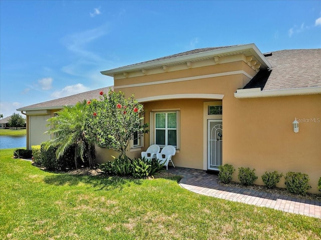 635 Chipper Dr, Sun City Center, FL 33573 - property entrance with a yard and stucco siding