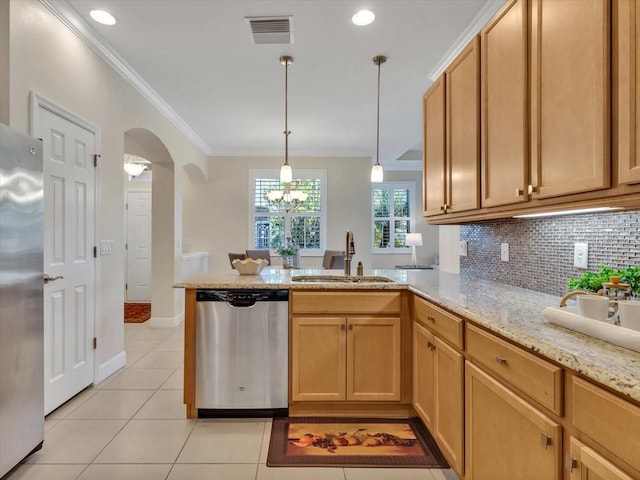 635 Chipper Dr, Sun City Center, FL 33573 - kitchen with stainless steel appliances, a sink, a peninsula, crown molding, and light tile patterned floors