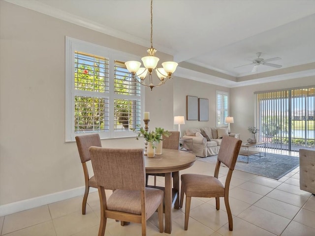 635 Chipper Dr, Sun City Center, FL 33573 - dining area featuring a chandelier, baseboards, light tile patterned floors, ornamental molding, and ceiling fan