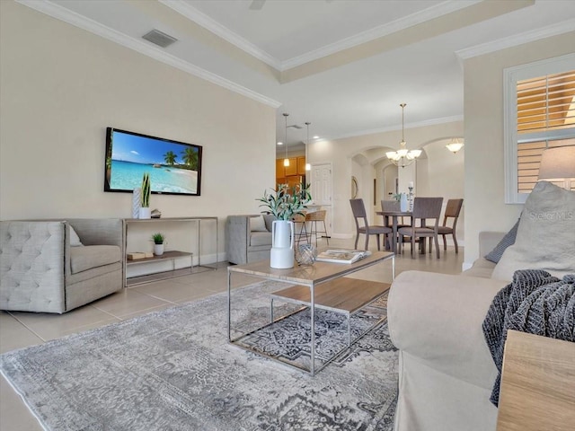 635 Chipper Dr, Sun City Center, FL 33573 - tiled living area featuring arched walkways, ornamental molding, and baseboards