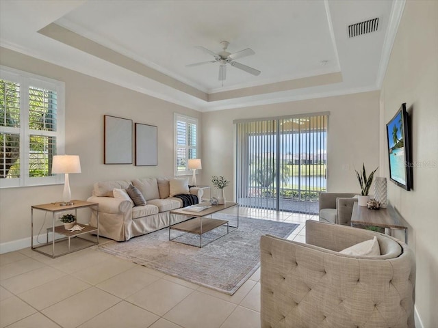 635 Chipper Dr, Sun City Center, FL 33573 - living area featuring a raised ceiling, a ceiling fan, plenty of natural light, and crown molding