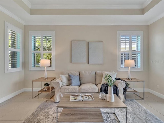 635 Chipper Dr, Sun City Center, FL 33573 - living area featuring a tray ceiling, tile patterned floors, healthy amount of natural light, ornamental molding, and baseboards