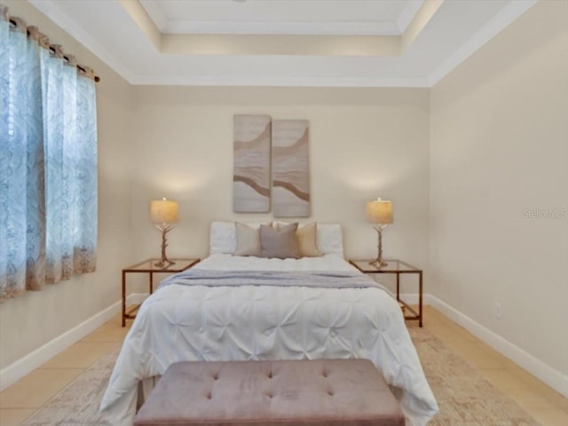 635 Chipper Dr, Sun City Center, FL 33573 - tiled bedroom with a tray ceiling, crown molding, and baseboards