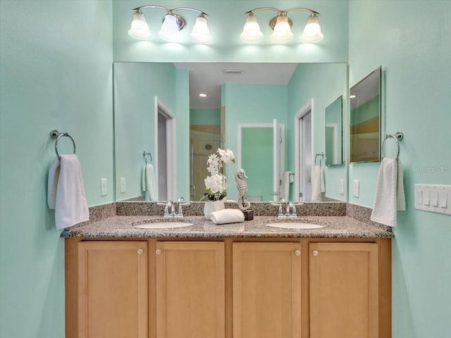 635 Chipper Dr, Sun City Center, FL 33573 - bathroom with double vanity and a tile shower