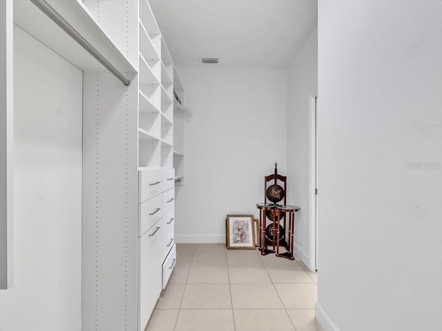 635 Chipper Dr, Sun City Center, FL 33573 - walk in closet featuring light tile patterned floors