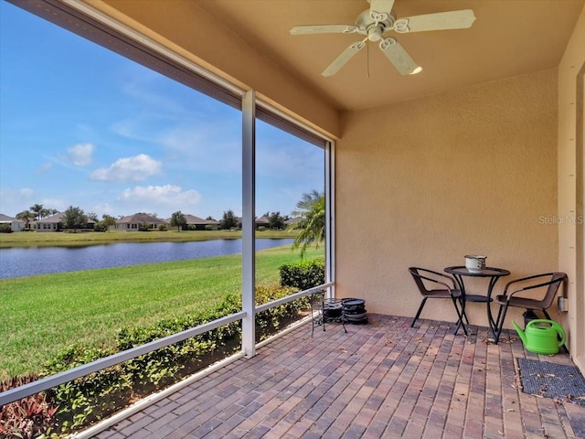 635 Chipper Dr, Sun City Center, FL 33573 - sunroom / solarium with a water view, ceiling fan, and healthy amount of natural light