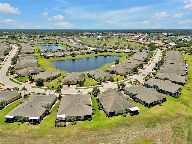 635 Chipper Dr, Sun City Center, FL 33573 - aerial perspective of suburban area featuring a nearby body of water